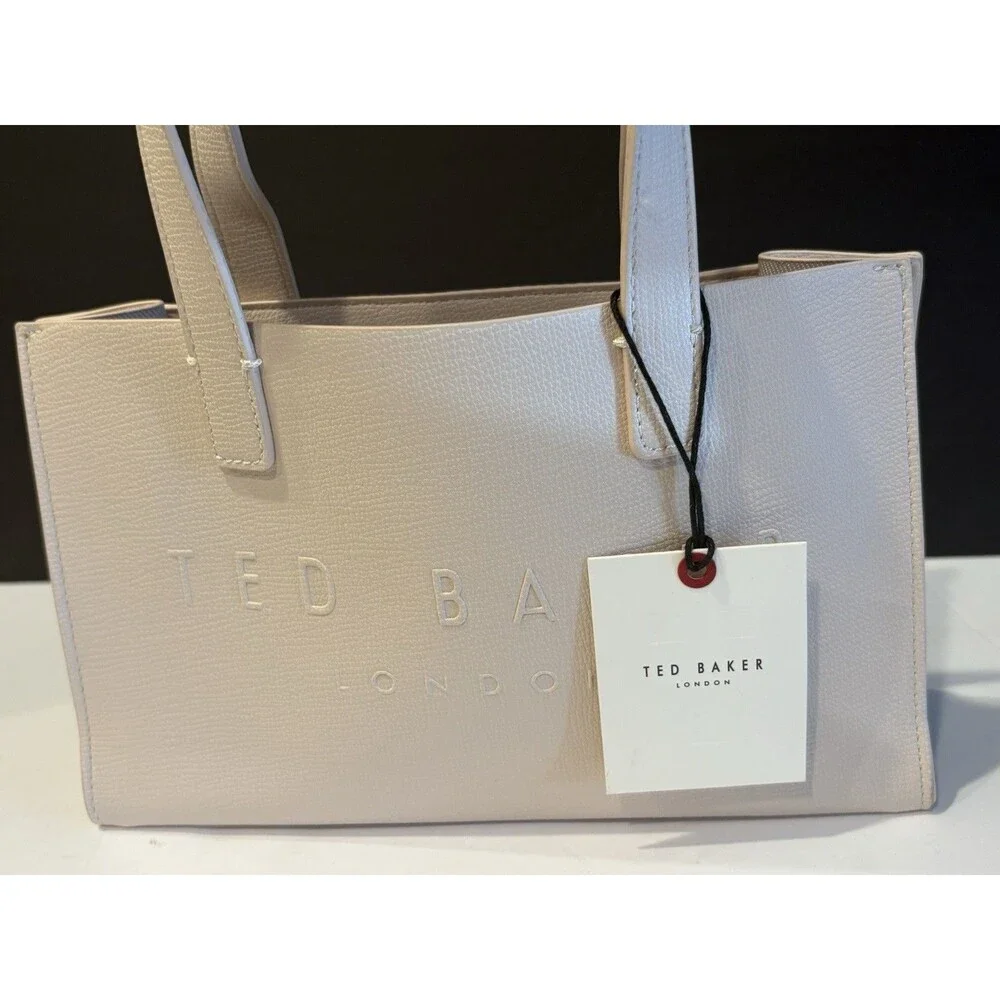 Ted Baker Icon small tote bag in a cream-colored, structured material.
